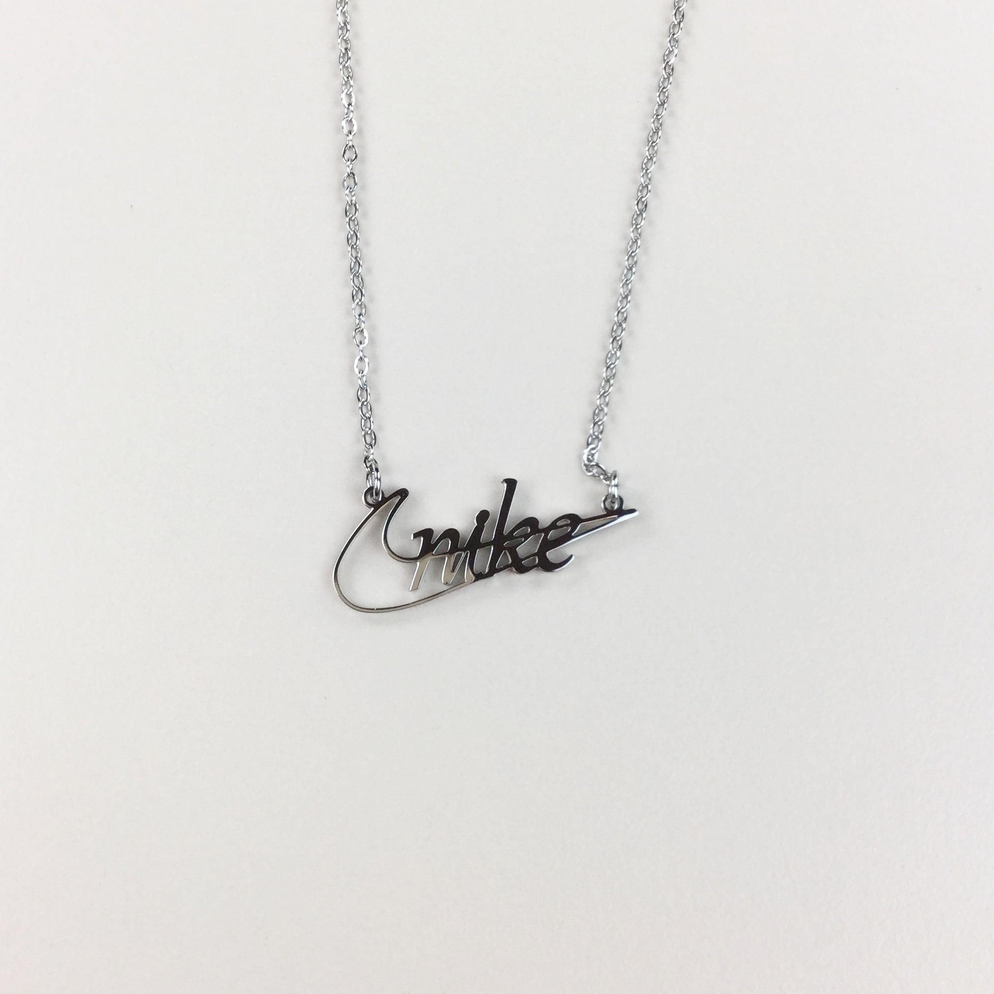Nike Swoosh Pixel Art Necklace : Silver Plated 