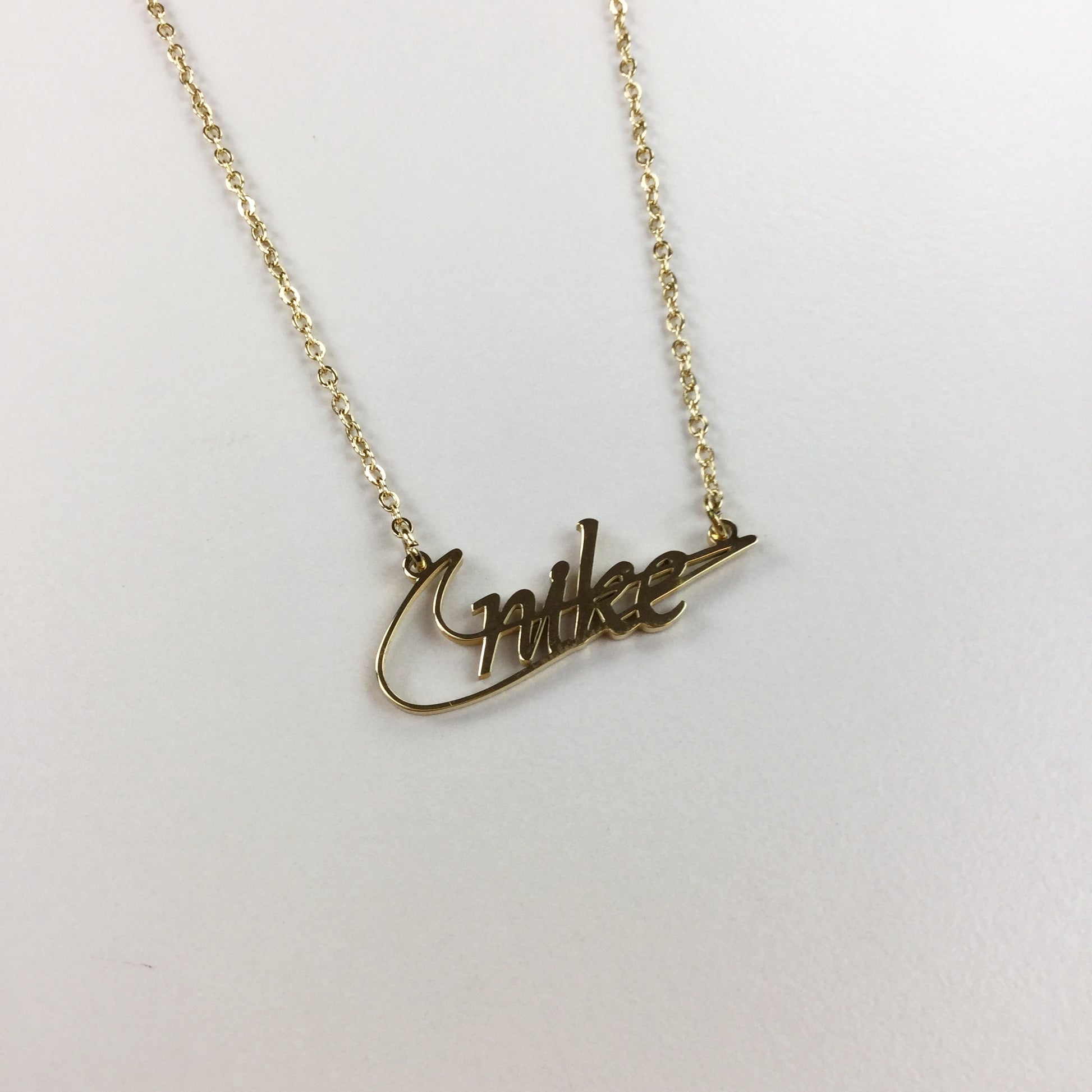 Nike Classic Cutout Gold Necklace-olesstore-vintage-secondhand-shop-austria-österreich